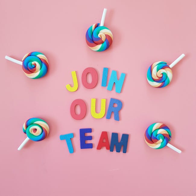 Vibrant Join Our Team message surrounded by colorful lollipops on pink background.